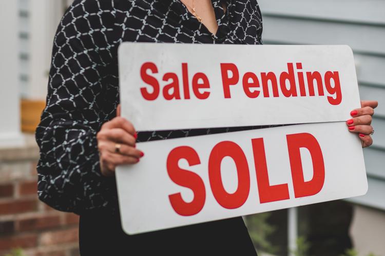 Sold sign in front of a house